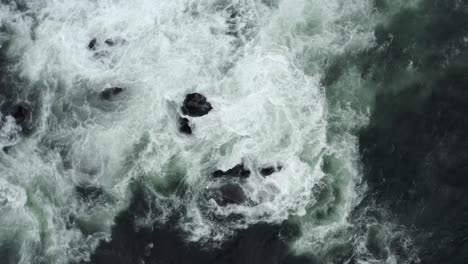 Overhead-View-Of-Rough-Waves-Crashing-On-The-Rocks