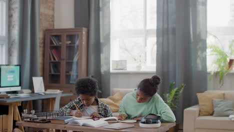 afro kids doing homework together