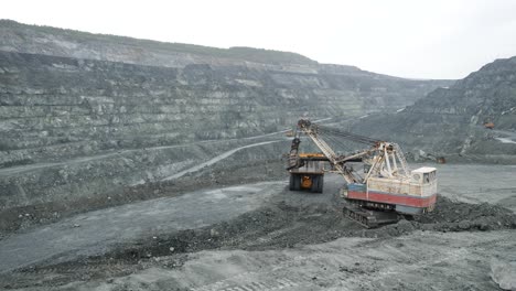 open pit mine with heavy machinery