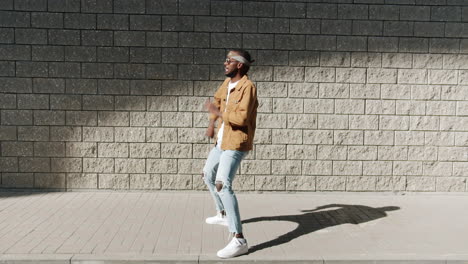 young man dancing in urban setting