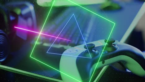 animation of neon shapes over video game computer equipment