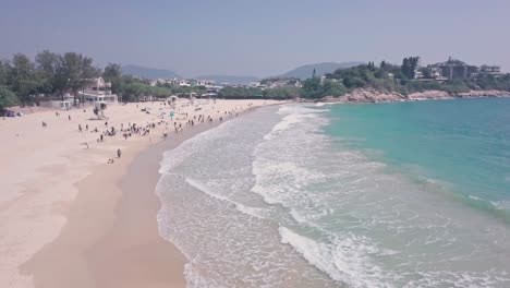 shek o beach, a white sandy stretch of sand in hong kong island. aerial drone view