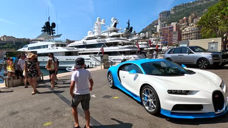 a luxury car near yachts in monte carlo