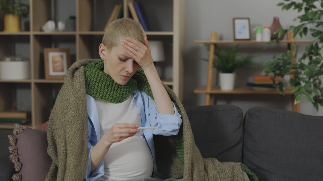 Pregnant Woman Checking Temperature