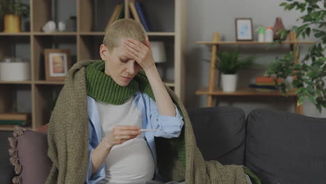 pregnant woman checking temperature