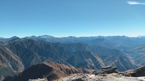 view from the top of ben lomond mountain in queenstown, new zealand blue skies sunny day