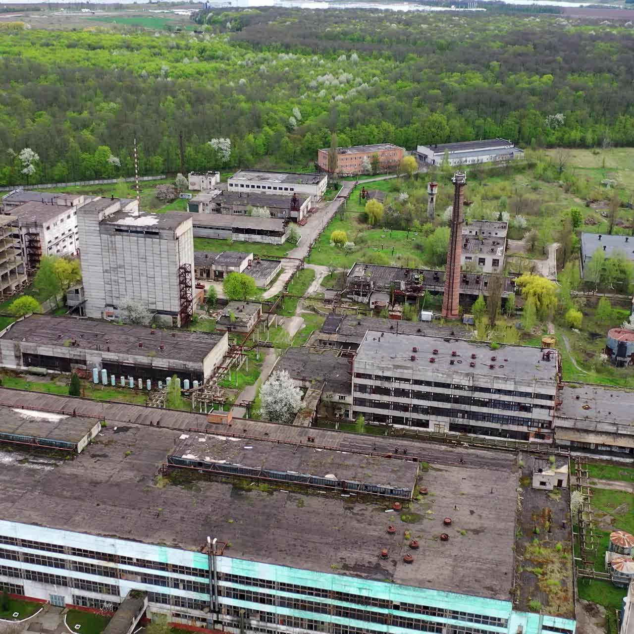 Empty apocalipse city with damaged houses. Aerial view of ruined abandoned building