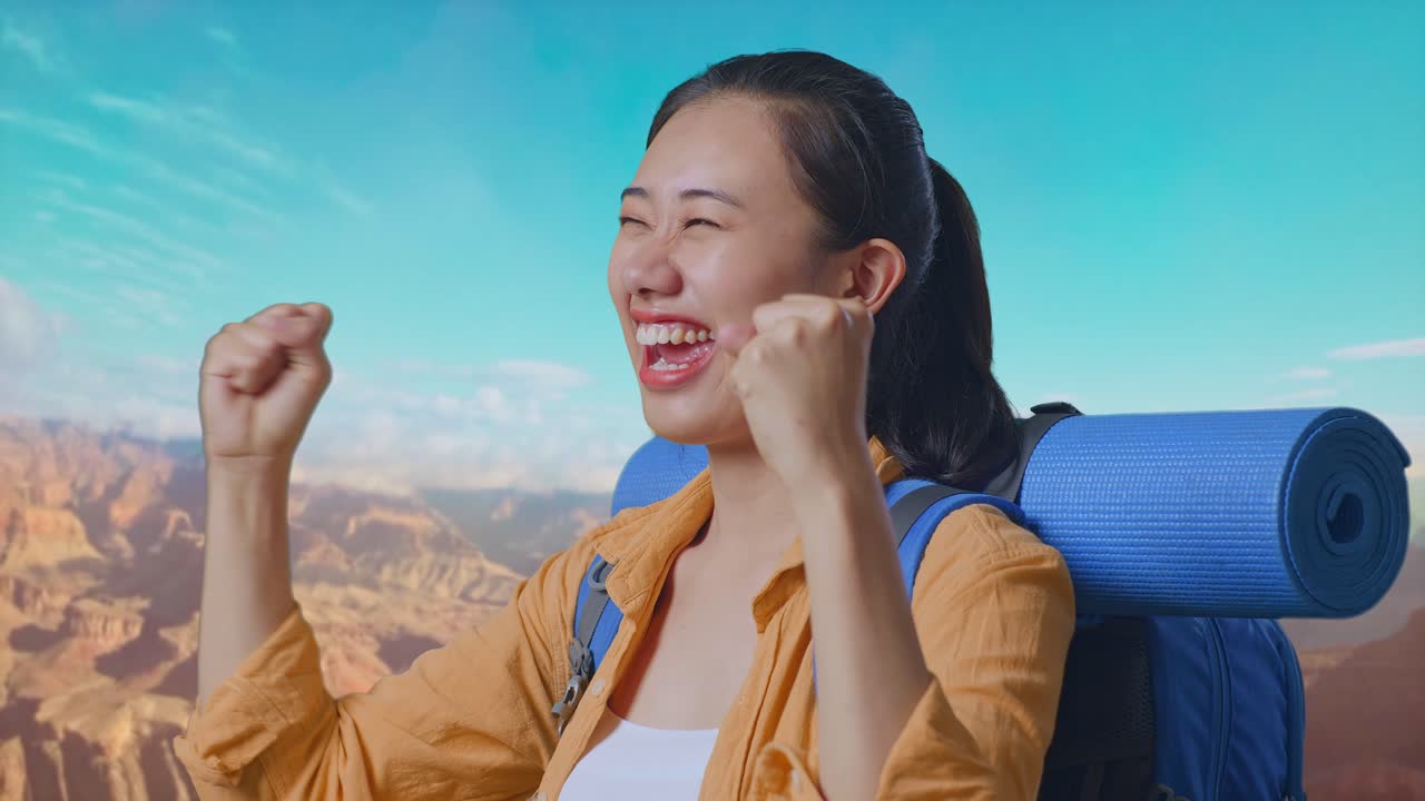 Close Up Side View Of Asian Female Hiker With Mountaineering Backpack Screaming Goal Celebrating The Success While Traveling At The Top Of Mountain