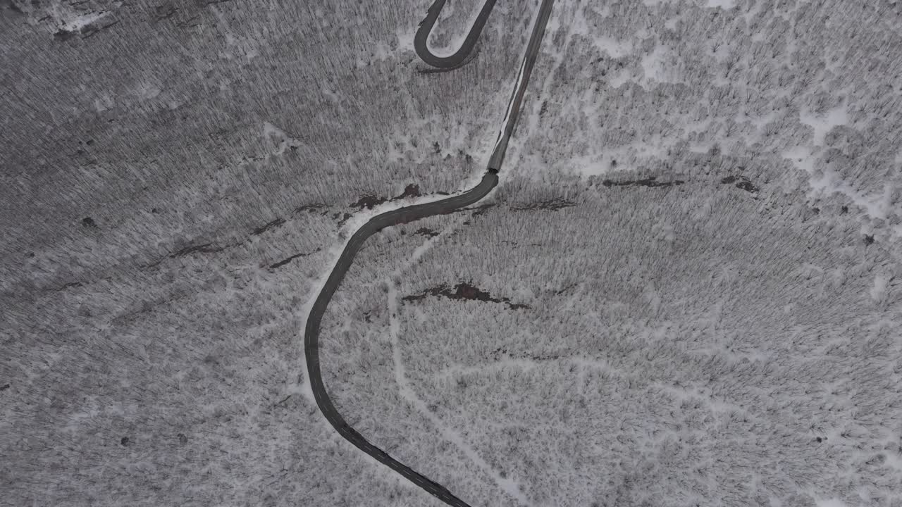 Aerial Drone View of Winding Road through Snowed landscape on Mount Zaō Japan