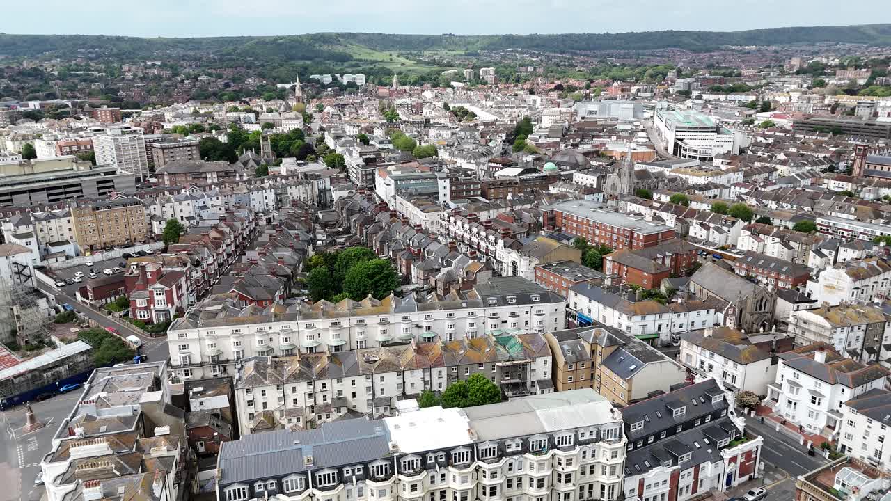 Flying high above Eastbourne city centre, this aerial journey captures urban charm with the majestic South Downs rolling peacefully in the distance.