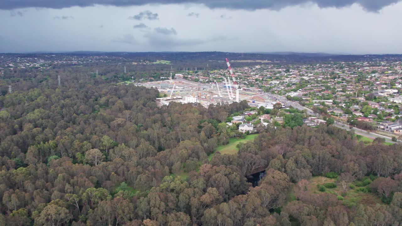 Panning aerial view of Blleen Road from Manningham Road to the Eastern Freeway during construction of the North East Link project in December 2023, Victoria, Australia.