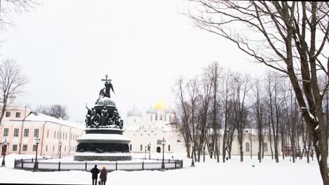 winter scene in a russian city with monument and church