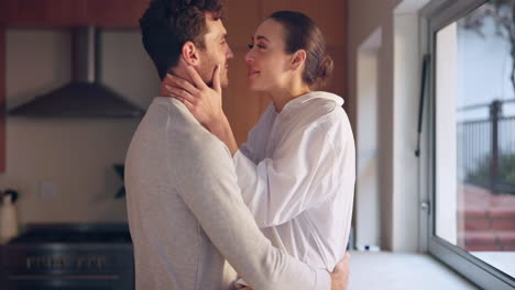 hug, love or couple talking in kitchen