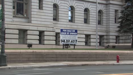 close up of sign or shield in front of old detroit city hall, michigan, usa