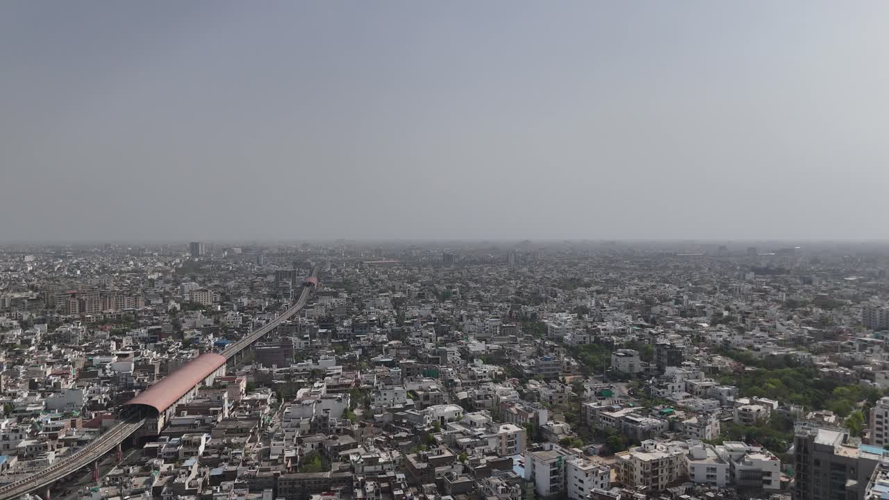 Scenic overhead view of Jaipur's densely populated areas where metro train passes through city
