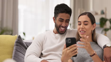 Phone,-happy-and-couple-on-sofa-in-home