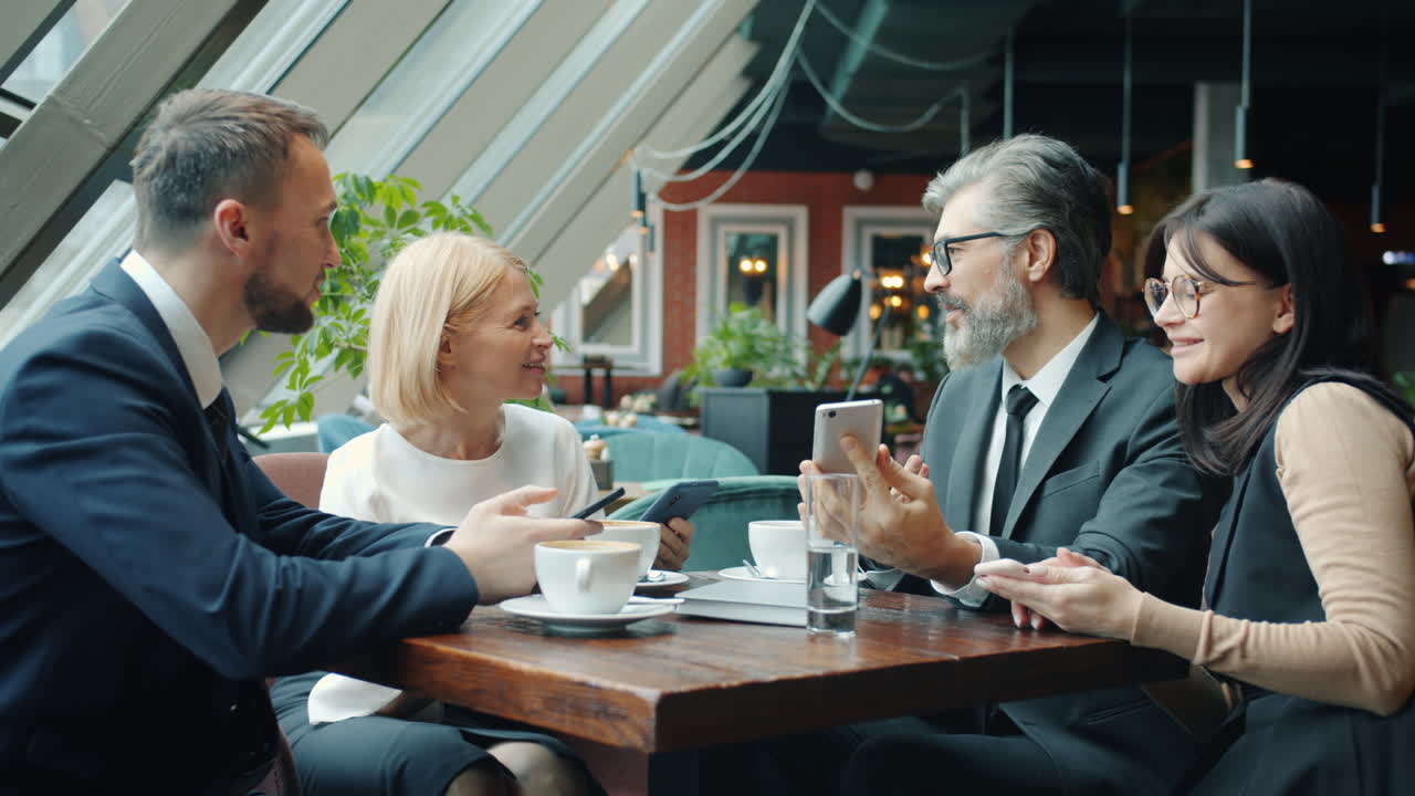 Business Team Meeting in a Cafe
