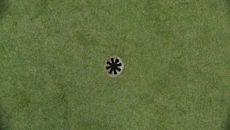 golf hole on a green