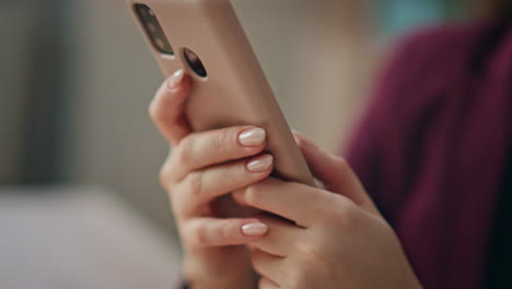 woman hands using smartphone tapping screen closeup. manager browsing cellphone