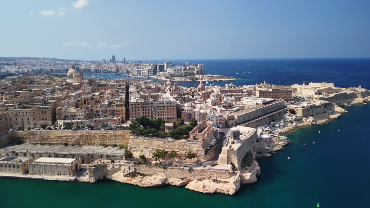 Aerial view of coastal city with historic architecture and blue sea