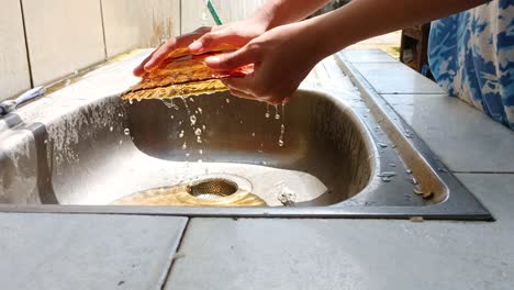 close up of washing a plate