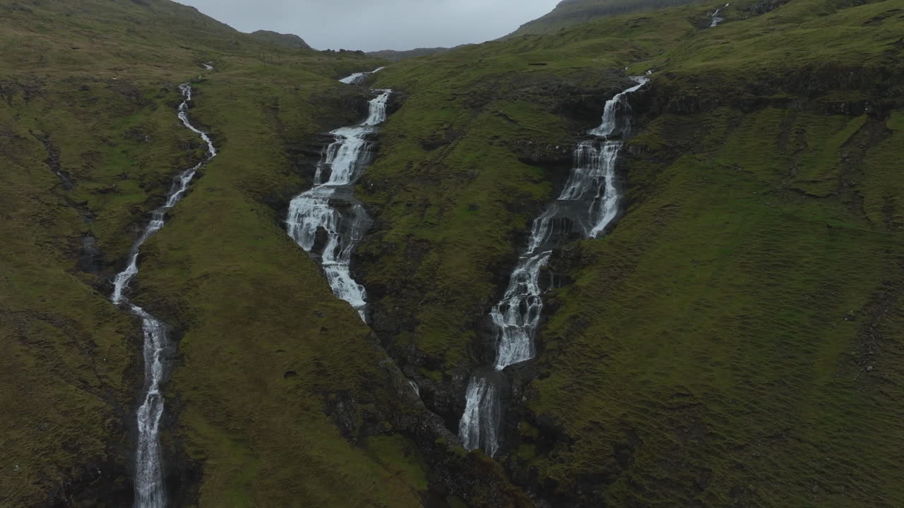 Oyggjarvegur mountain, Faroe Islands: aerial view traveling in to the waterfalls of this great mountain, near the Kaldbaksfj&oslash;r&eth;ur fjord and a spectacular landscape