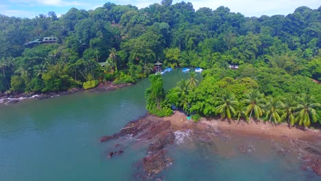 Overlooking-a-small-water-inlet-with-many-boats-tied-off-to-shore-on-a-sunny-day-at-Drake-Bay-in-Costa-Rica