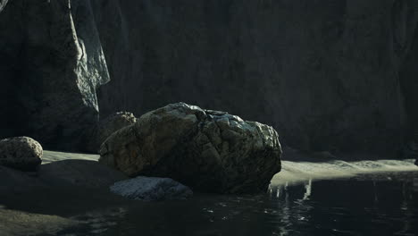 solitary rock on a dark beach