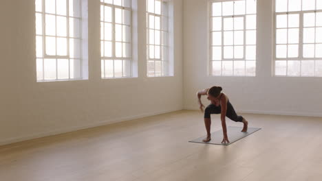 beautiful yoga woman practicing extended side angle pose enjoying fitness lifestyle exercising in studio stretching flexible body training meditation on exercise mat at sunrise