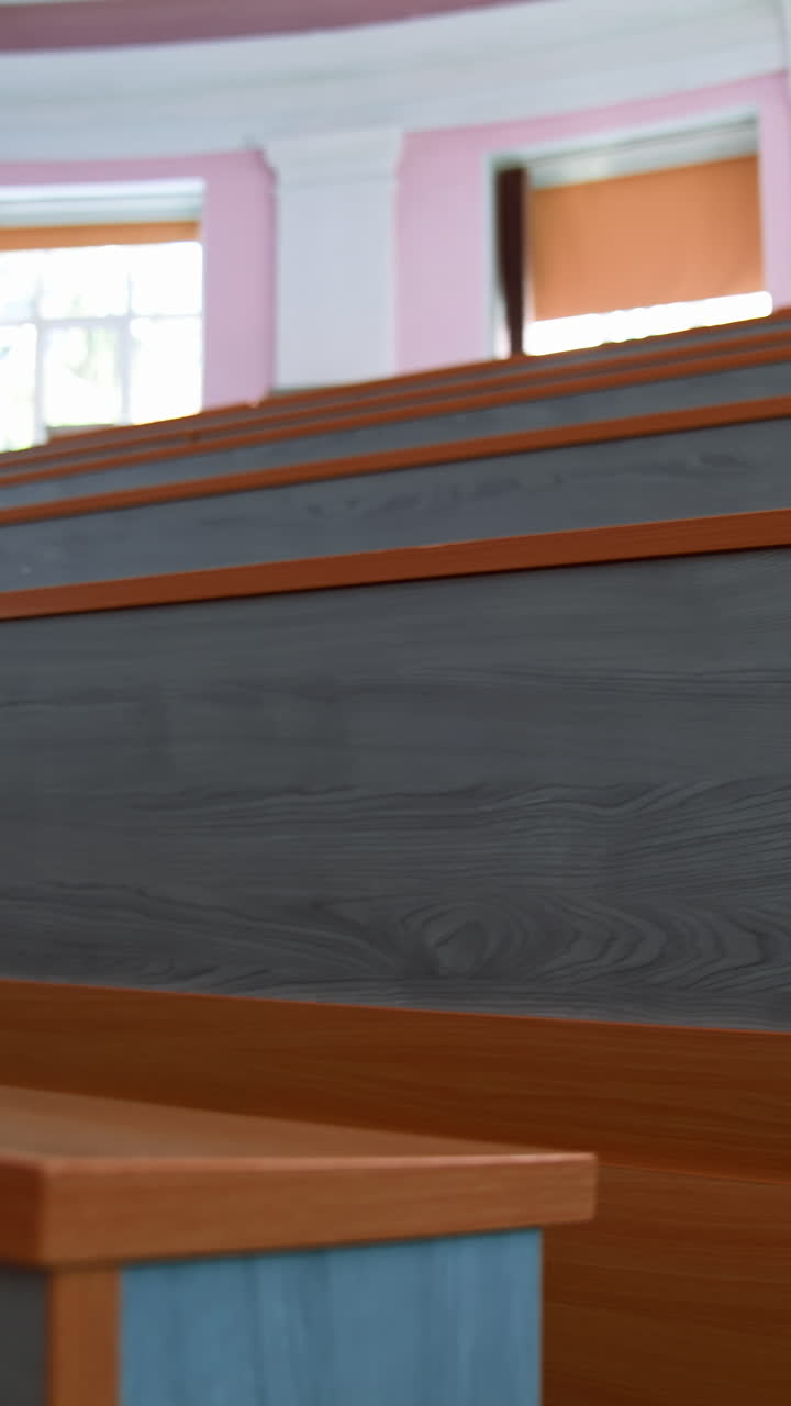 Empty seats in university classroom. Empty lecture hall with large amount of seats. Vertical video