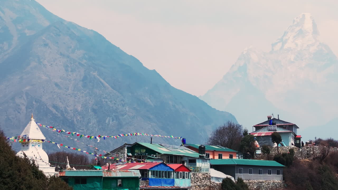 Aerial view from Mongla View Point enroute to Everest Base Camp with Everest peak, layered hills, village houses, and serene landscape of Nepali spirituality