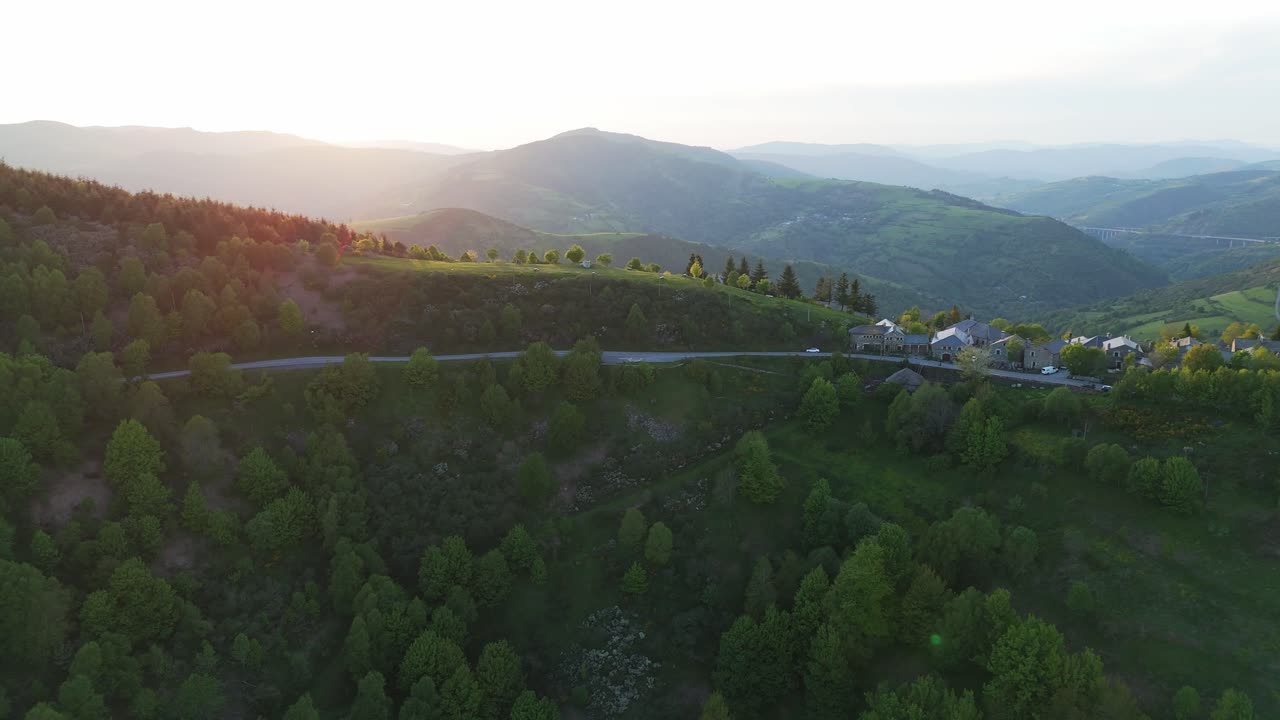 Aerial View of a Village in the Mountains at Sunset