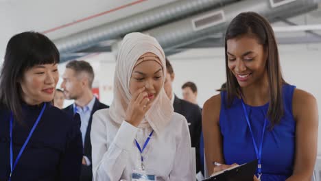 Women-in-the-audience-at-a-business-seminar-talking