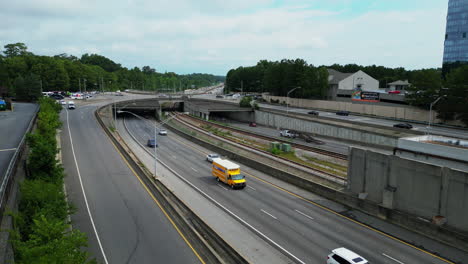 Aerial-view-of-busy-multilane-expressway-and-multilevel-road-intersection-in-urban-neighbourhood