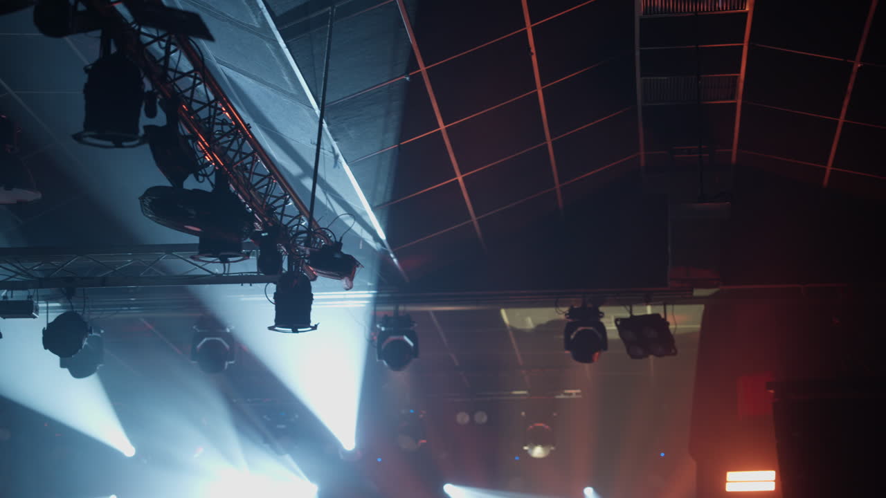 Dynamic Stage Lights Moving and Changing Colors in a Concert Venue