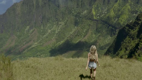 lush green mountain landscape with clouds and waterfalls