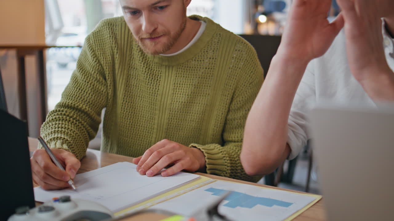 Serious businesspeople discussing together watching computer at office closeup