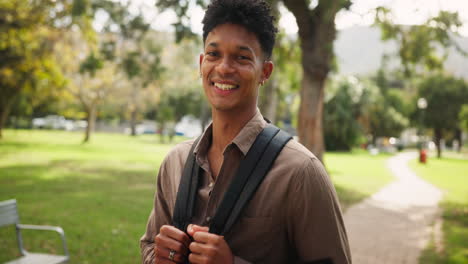 young man on college campus with backpack