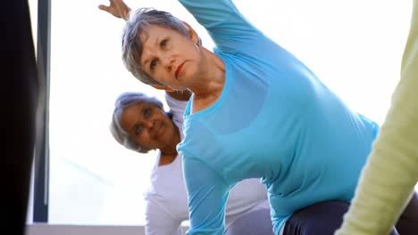 Senior-women-performing-yoga-4k