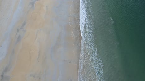 zenithal view of waves crashing on luskentyre beach, scotland