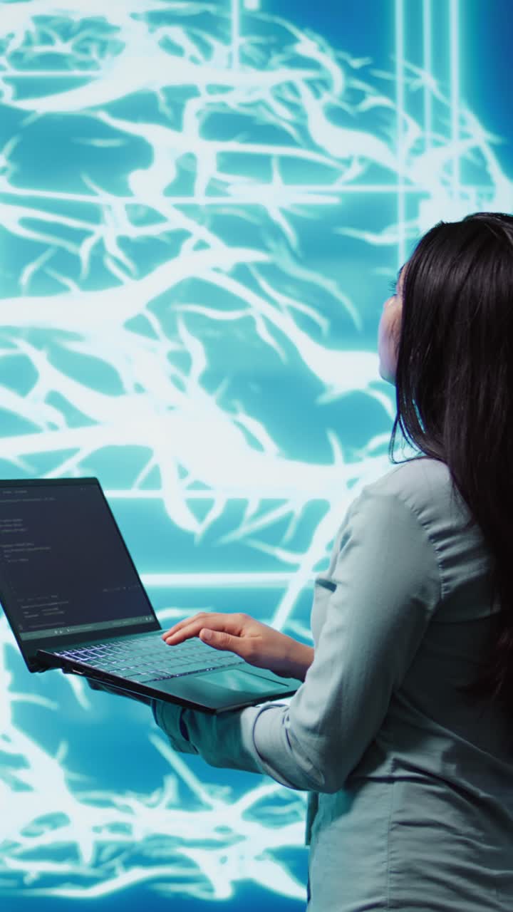 Vertical video Computer scientist working on laptop, programming artificial intelligence