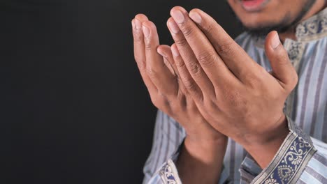 muslim man praying during ramadan, close up