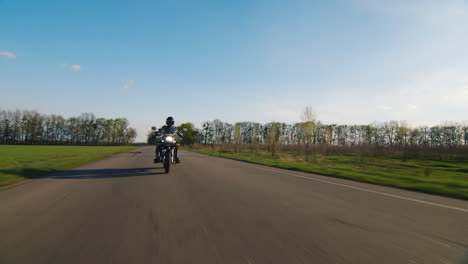 motorcyclist appears in the frame shooting on the move smoothly and without shaking