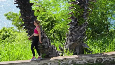 woman walking in a tropical park