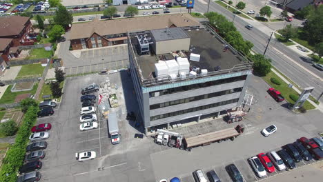 drone circling around a large industrial building under construction