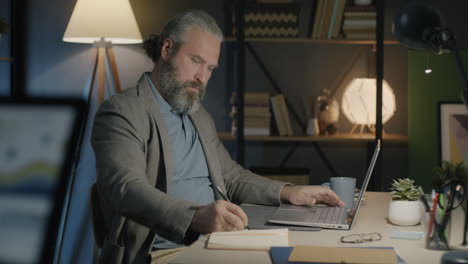 man working from home at night