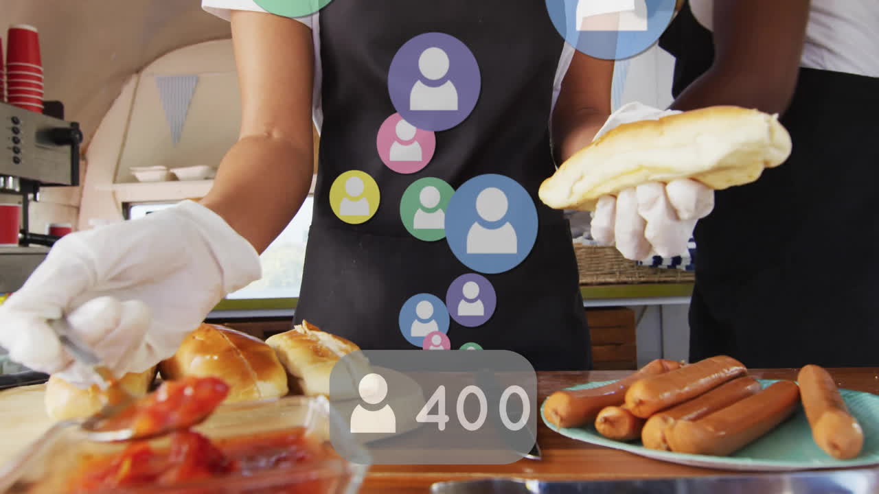 Serving food, person with gloves preparing sandwiches, social media interaction animation over