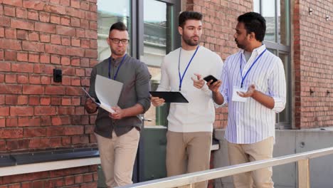 Businessmen-with-Name-Tags-Walking-Upstairs