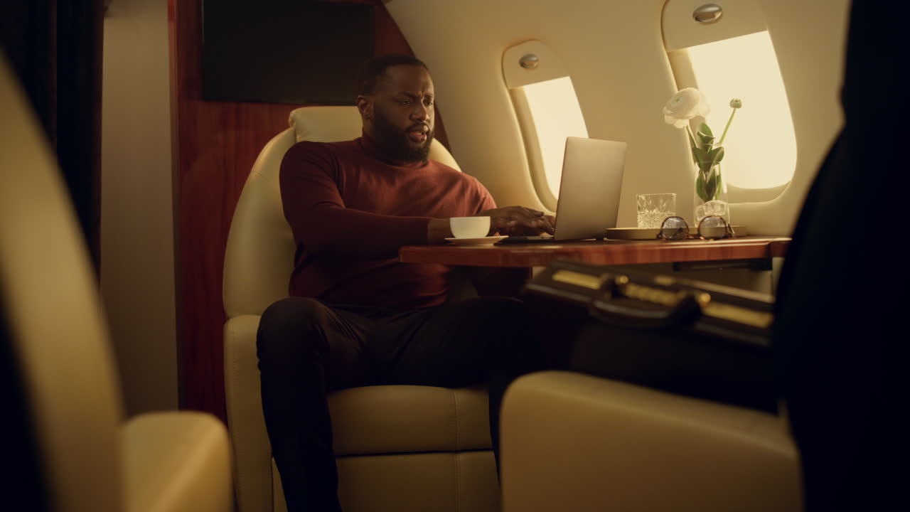 Financial analyst working online on corporate flight. Successful ceo typing