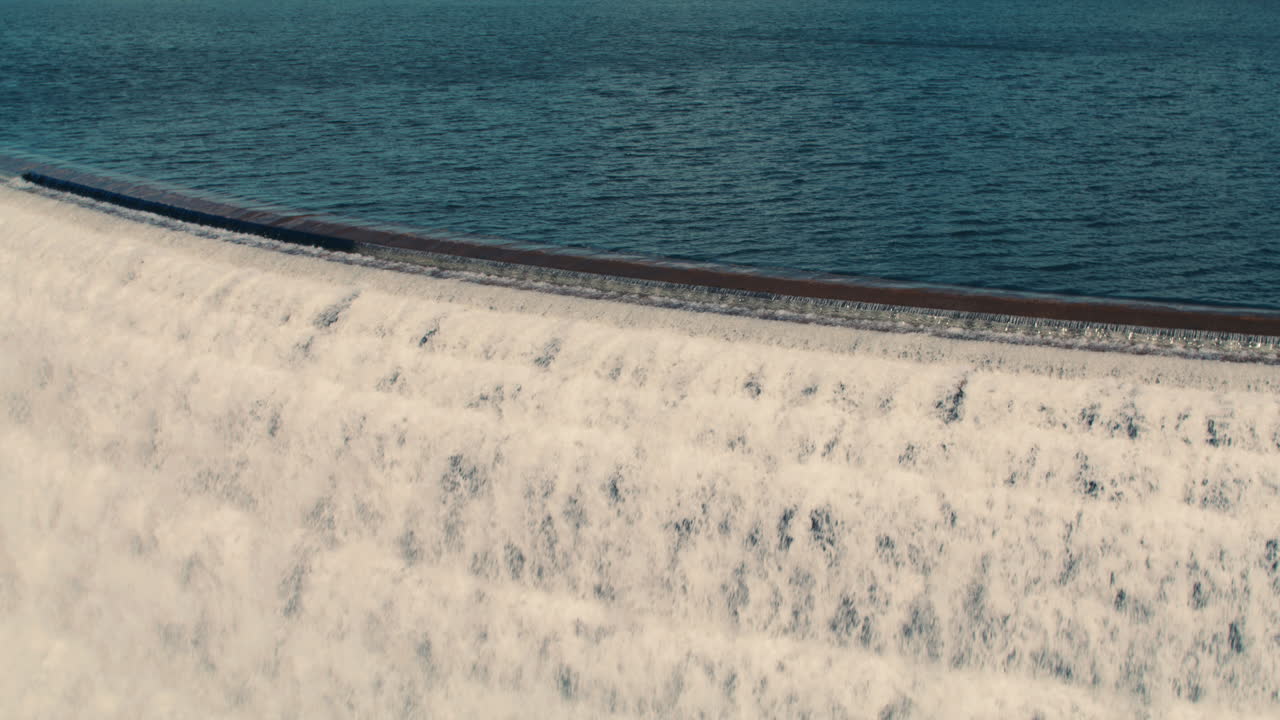 medium shot of new croton reservoir stepped spillway and lake. slow motion 40fps